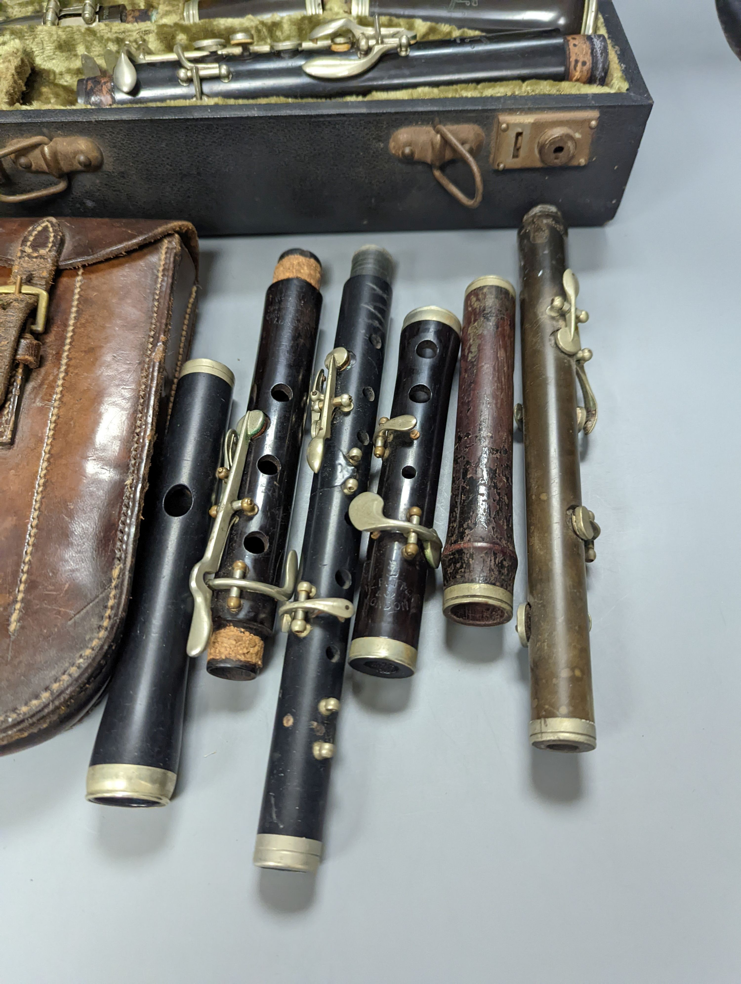 Three ebony or rosewood flutes and a clarinet